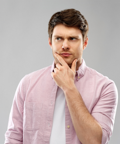Brunette man wearing a pale pink shirt and looking unsure - perhaps about how life insurance works